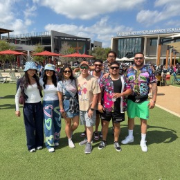 people in bright clothing outdoors on grass