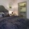 Furnished bedroom with walk in closet and ensuite at Savannah Oaks upscale apartments in San Antonio