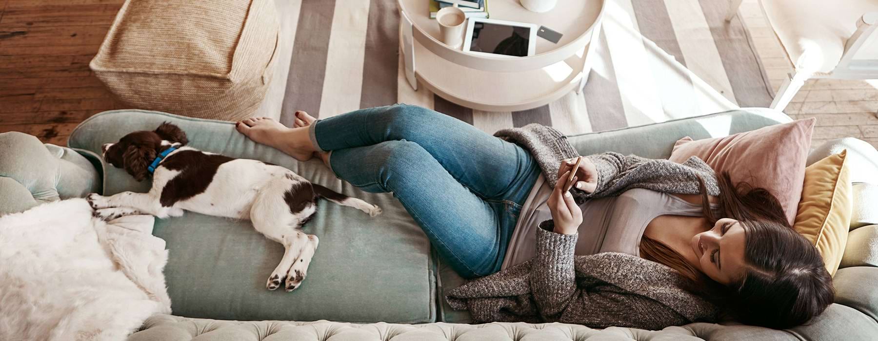 woman on couch with dog
