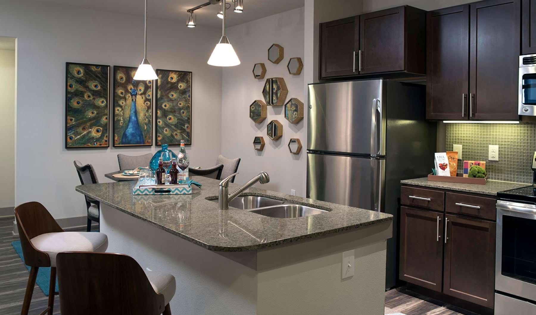 Kitchen Luxury kitchen with stainless steel appliances and breakfast bar at Savannah Oak the best apartments in San Antonio